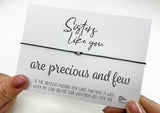 a person holding a card with a message on it