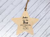 a wooden star ornament with a saying on it