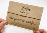 a person holding a card with a message on it