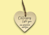 a ceramic heart hanging on a string