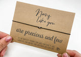 a person holding a card with a message on it