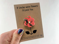 a person holding a card with a flower on it