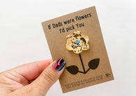 a person holding a card with a flower on it