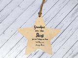 a wooden star ornament hanging from a string