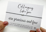 a person holding a card with a message on it