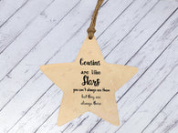 a wooden star ornament hanging from a string