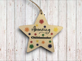 a wooden star ornament with an inscription on it