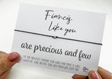 a person holding a card with a message on it