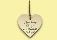 a heart shaped ceramic ornament with a message