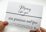 a person holding a card with a message on it