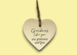 a ceramic heart hanging on a string