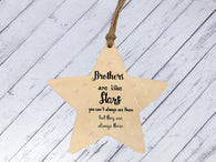 a wooden star ornament with a message on it