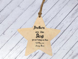 a wooden star ornament with a message on it